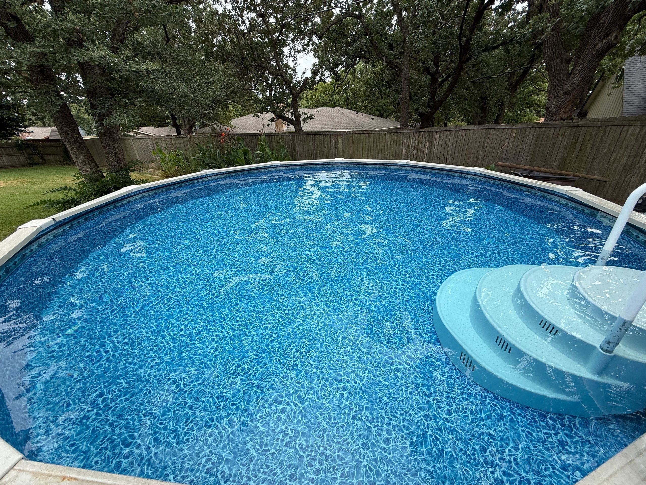 Backyard swimming pool with floats