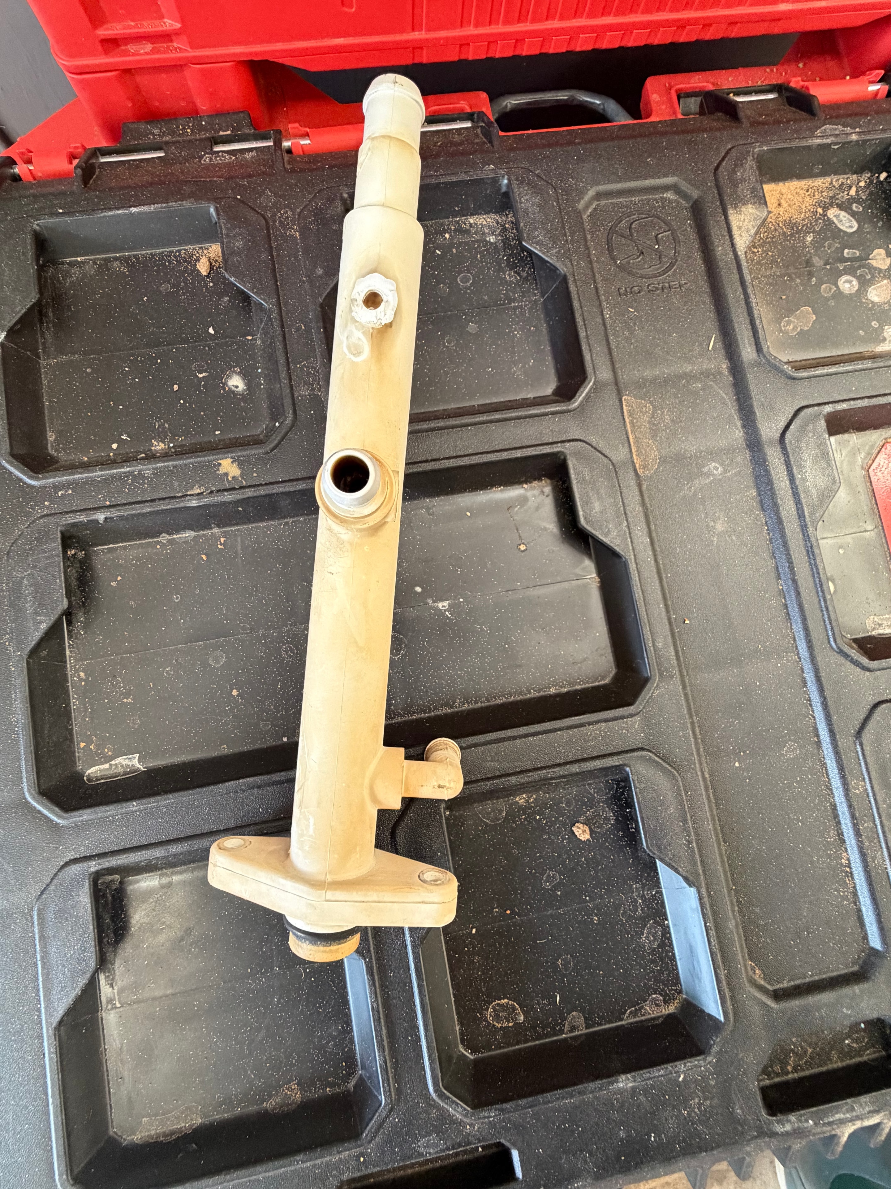 Worn pool cleaner manifold removed and laid out for inspection before repair